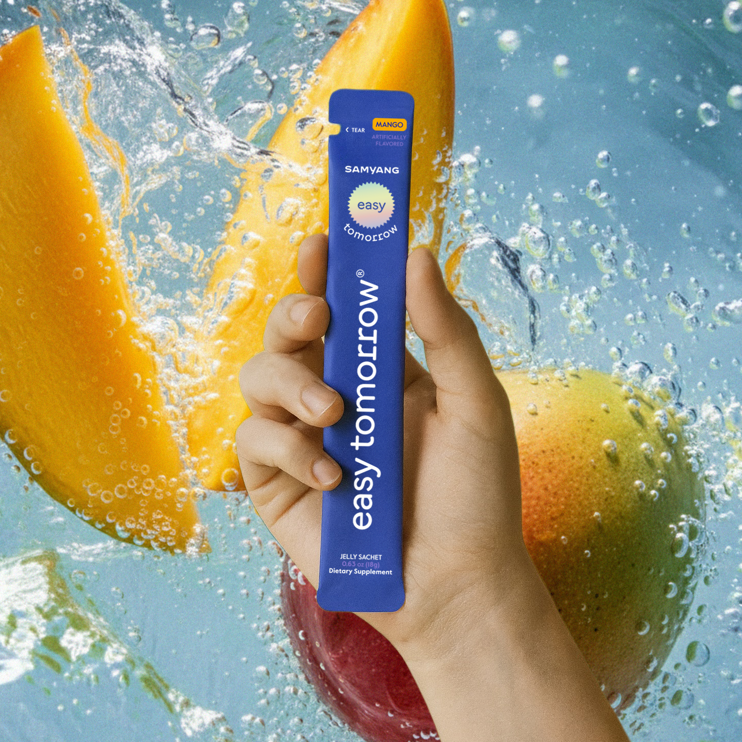 A hand holding a Mango-flavored Easy Tomorrow sachet