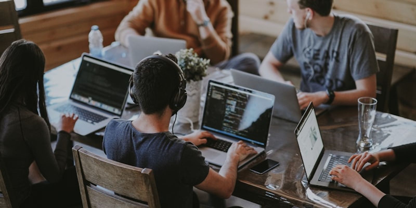 Modern business team collaborating with AI transcription technology