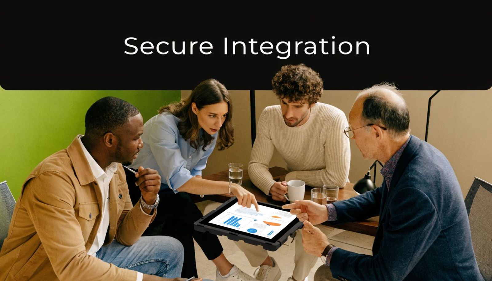 A diverse group of professional colleagues collaborating around a tablet displaying data charts in an office.