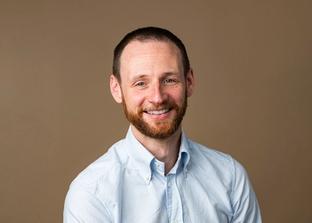 Philip Feast photographed with a colorama background in a studio