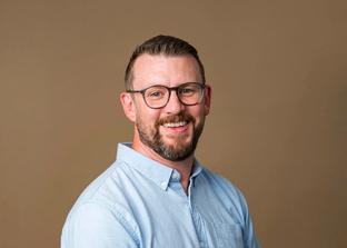 A photo of Paul Bannister taken with a colorama backdrop