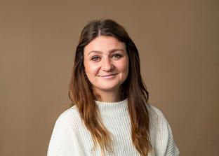 Wealth manager Sophie Hendy photographed with a colorama backdrop