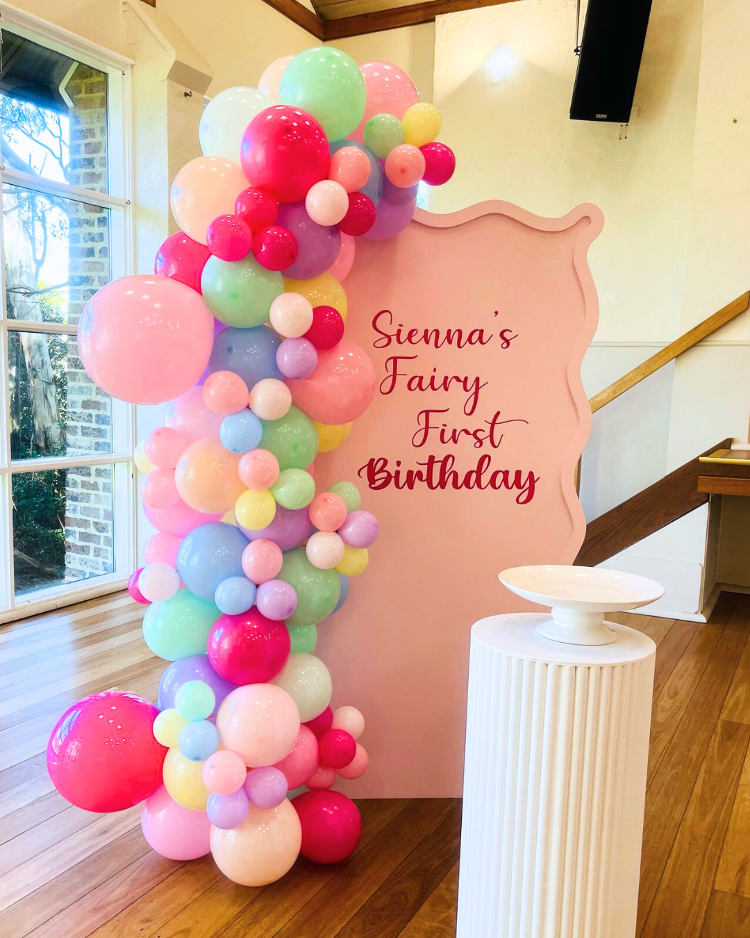 Colorful balloon garland, Wavy backdrop and fluted plinth Setup
