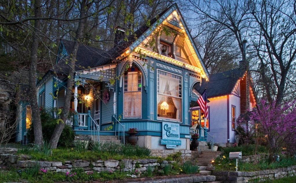 Cliff Cottage Inn lit up at twilight