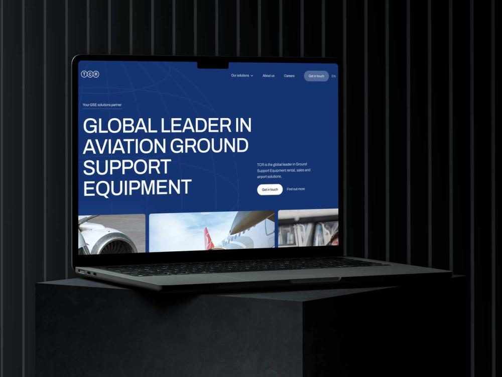 Macbook mockup of the TCR Group website