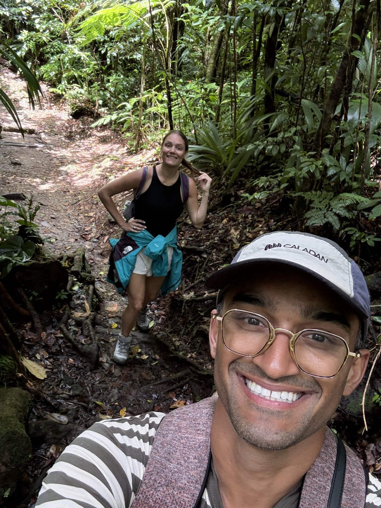 Daniel and Alex hiking a jungle trail together