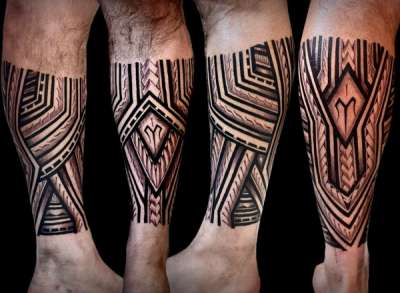 Blackwork tribal geometric design on calf