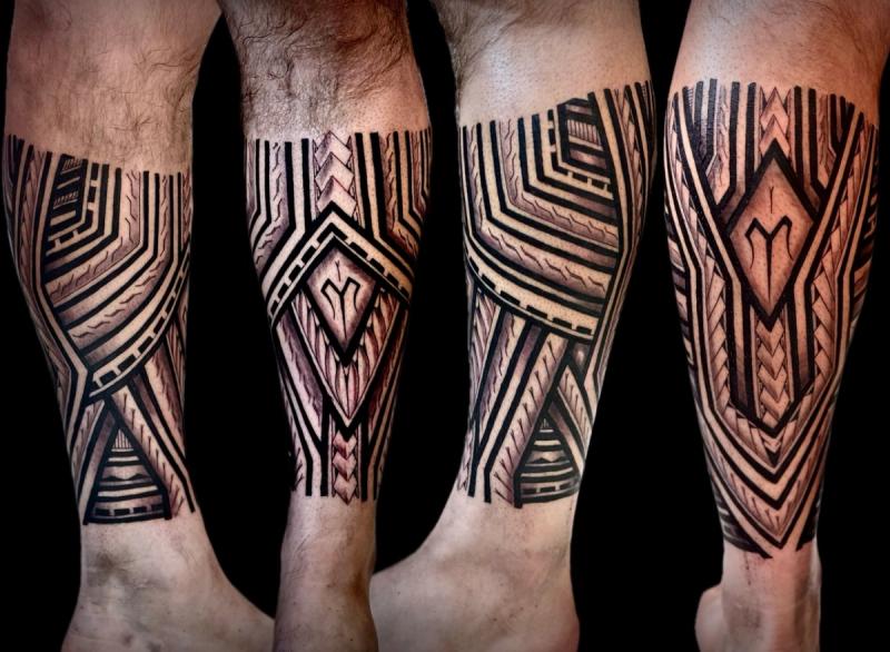 Blackwork tribal geometric design on calf