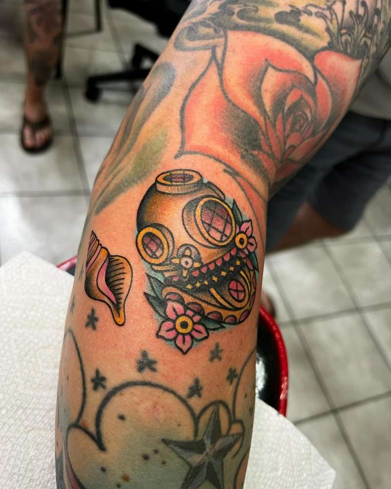 Colorful Neotraditional diver helmet tattoo with flowers on forearm