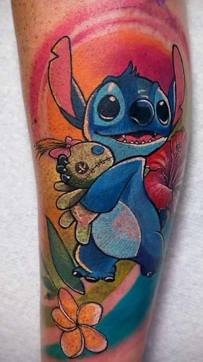 colorful cartoon tattoo on a calf