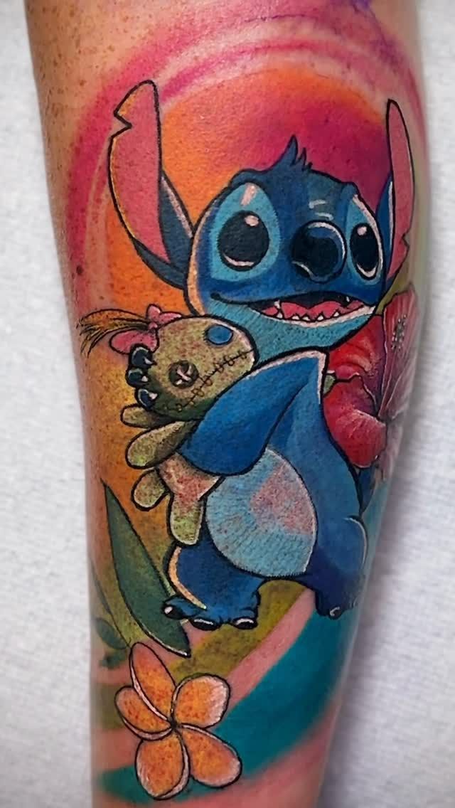 colorful cartoon tattoo on a calf