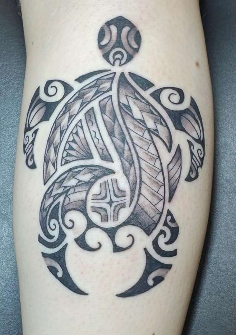 Black and grey tribal turtle tattoo on calf