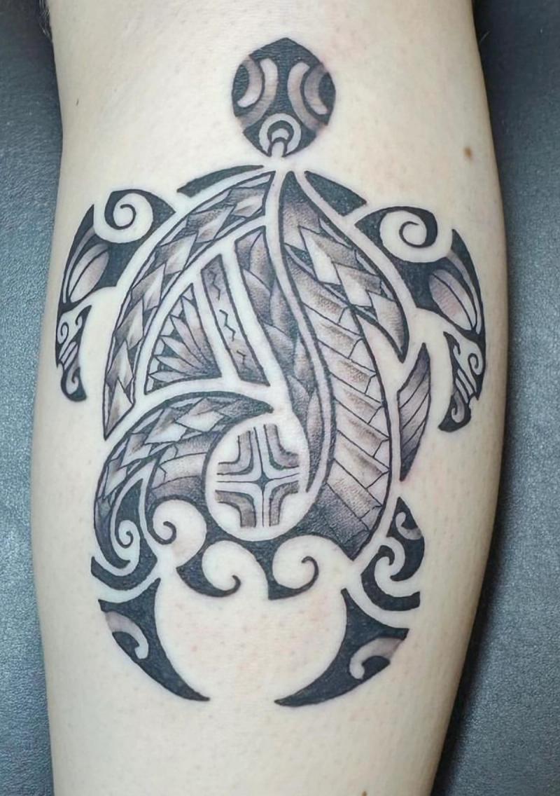 Black and grey tribal turtle tattoo on calf