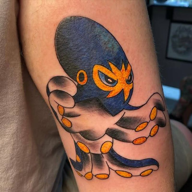 colorful octopus tattoo on upper arm