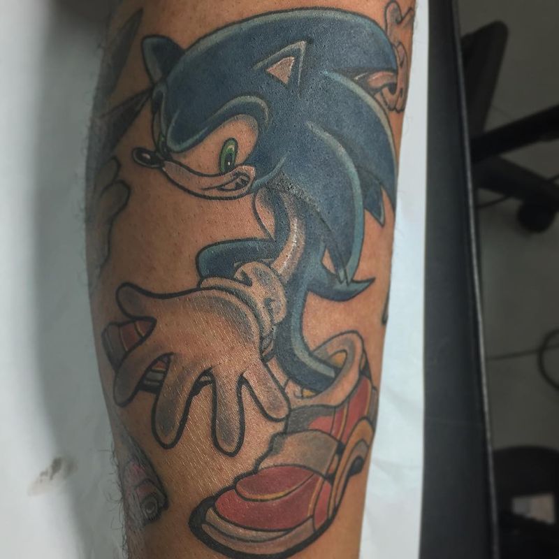 illustrative sonic character tattoo on forearm