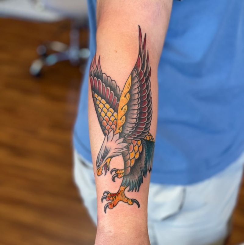 Colorful traditional eagle tattoo on forearm