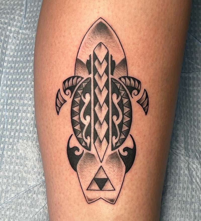 Black tribal turtle tattoo on calf