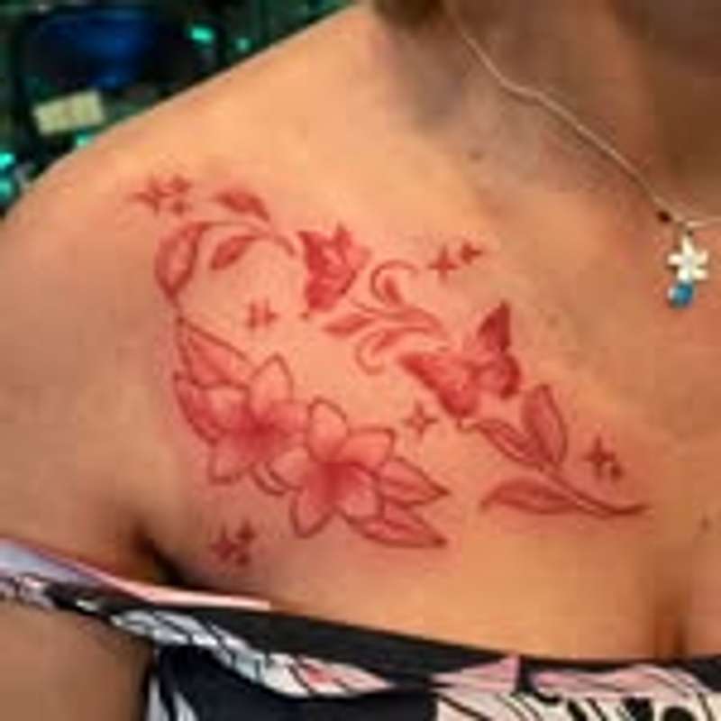 Redwork floral and butterfly tattoo on upper chest