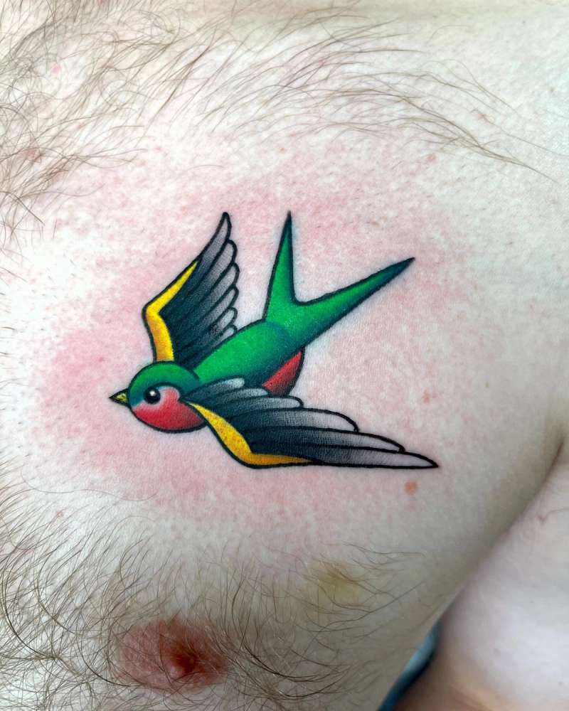 colorful swallow tattoo on chest