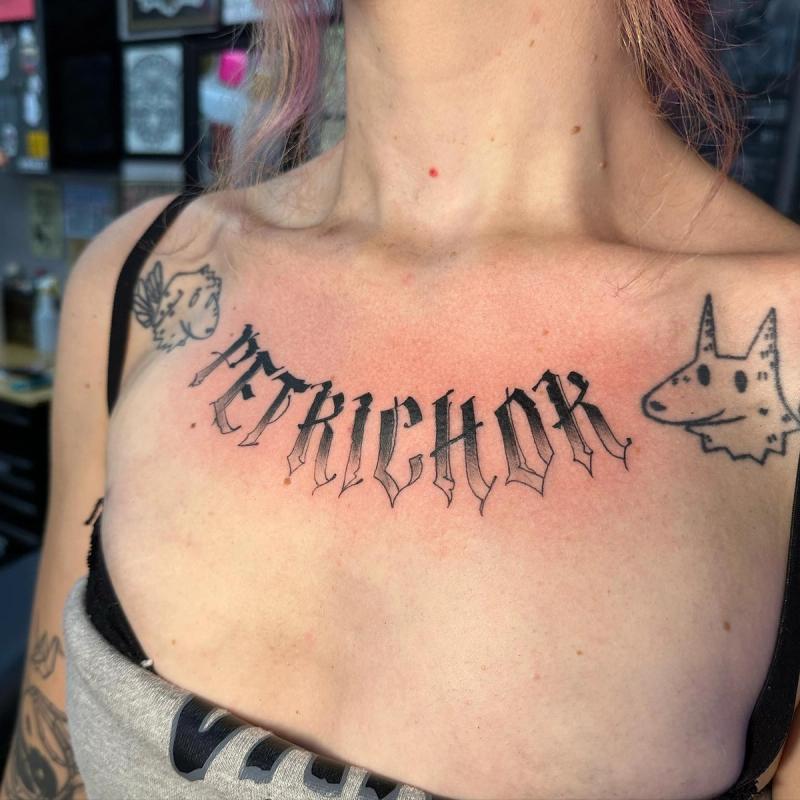lettering tattoo on chest