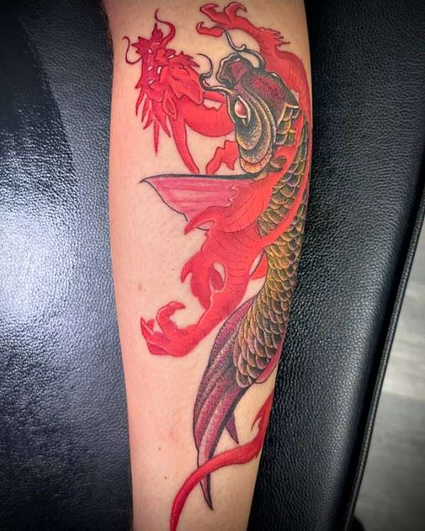 colorful dragon tattoo on forearm