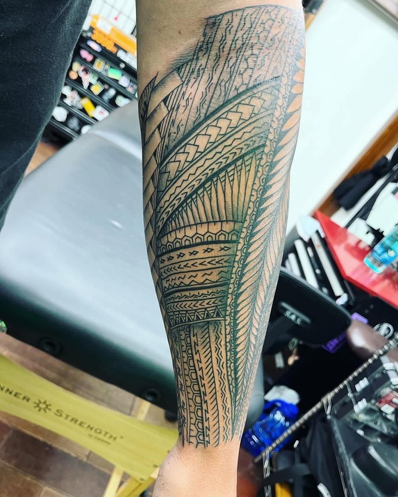 polynesian tribal geometric tattoo on forearm
