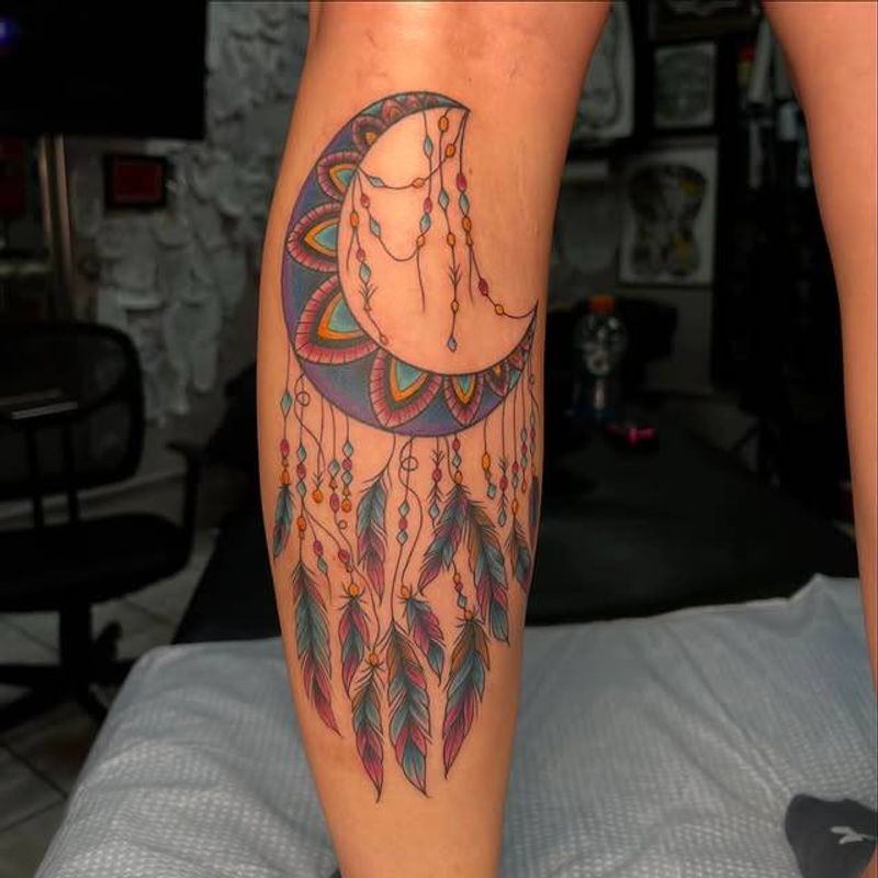 Colorful geometric crescent moon tattoo on calf
