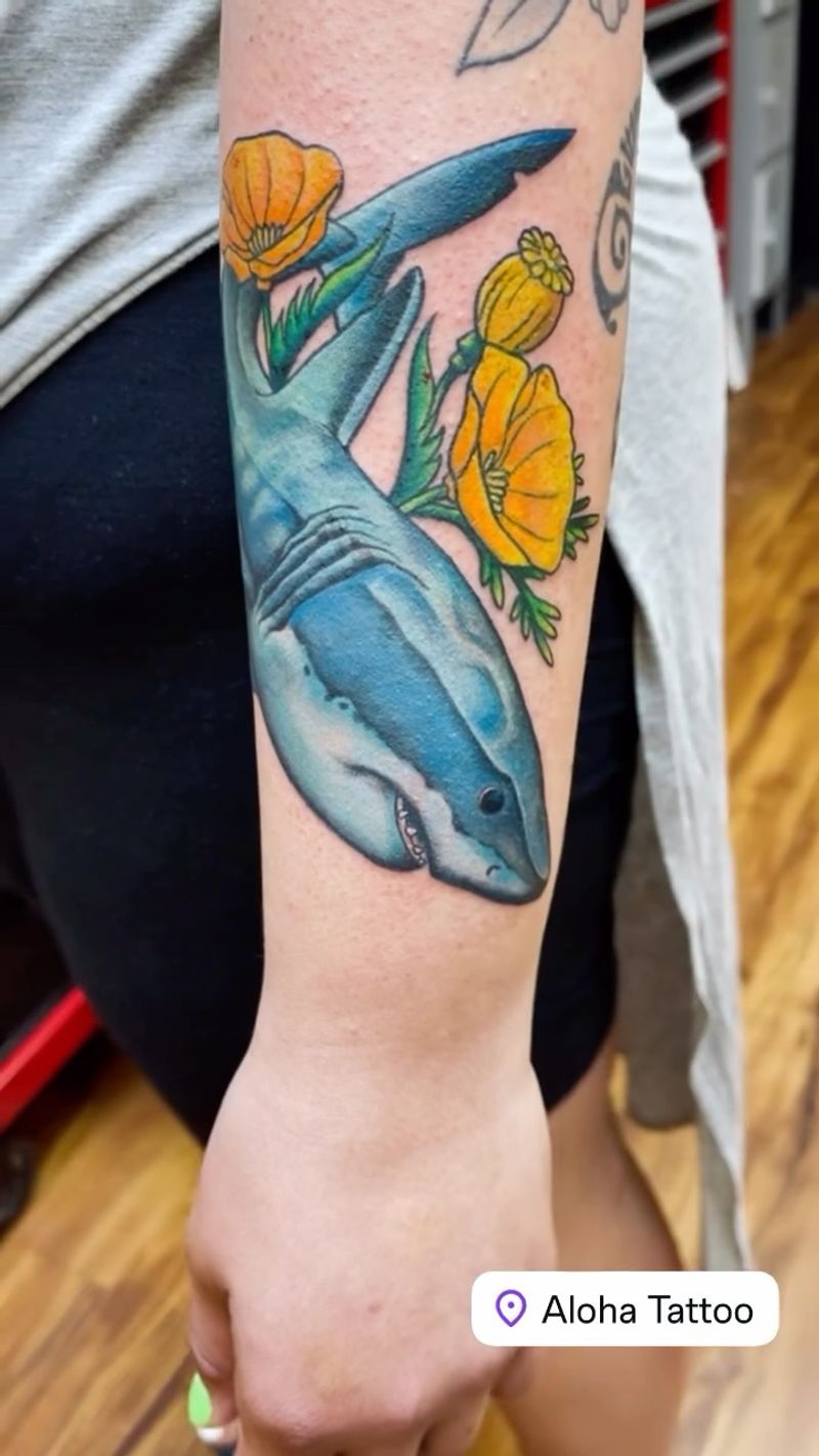 realistic shark and flowers tattoo on forearm