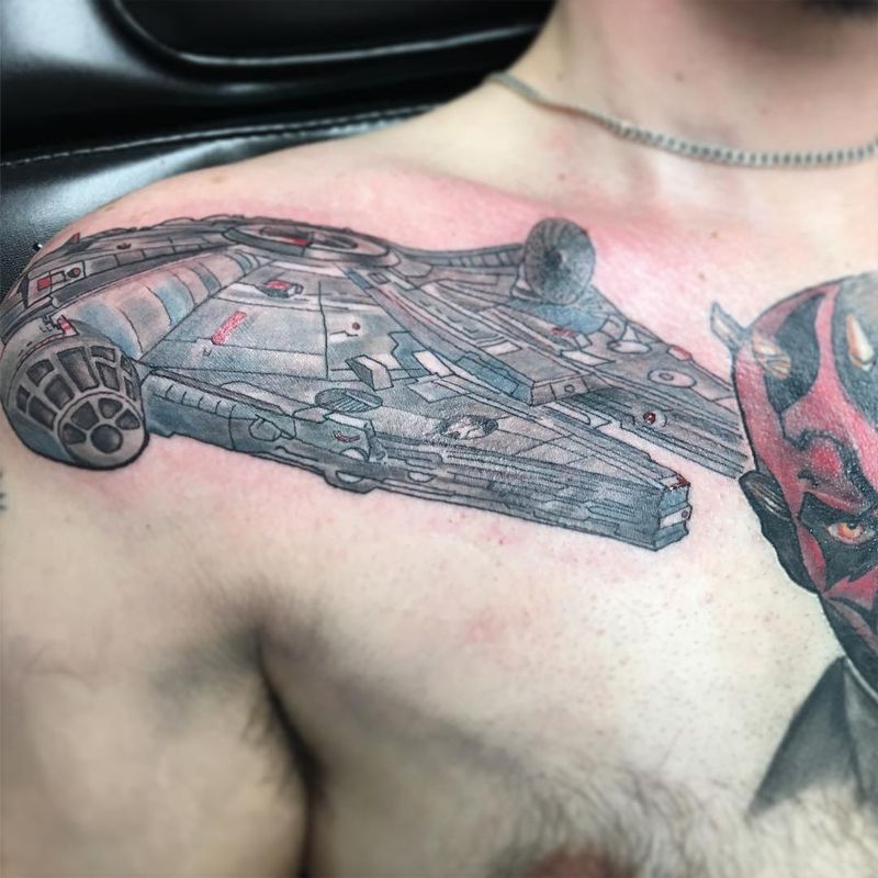 colored spaceship tattoo on chest