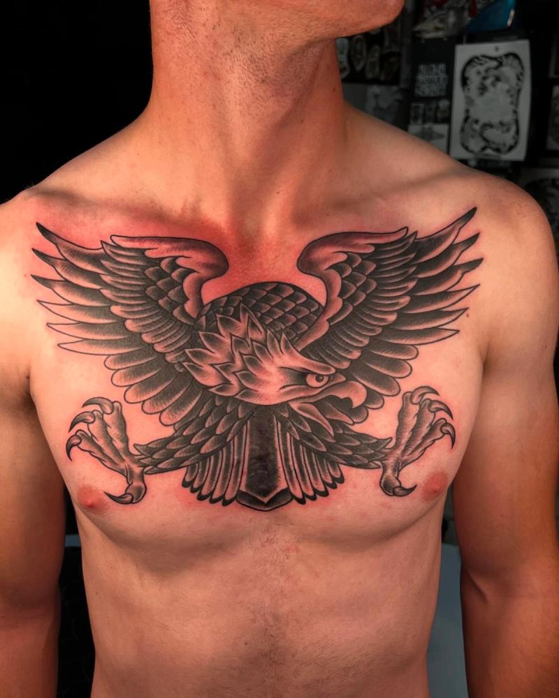 Black and grey traditional eagle tattoo on chest