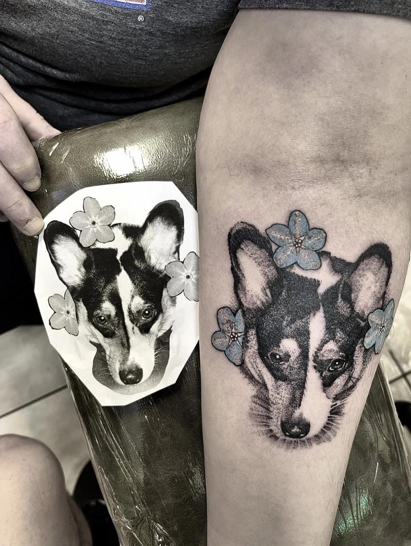 corgi dog portrait tattoo with blue flowers on forearm