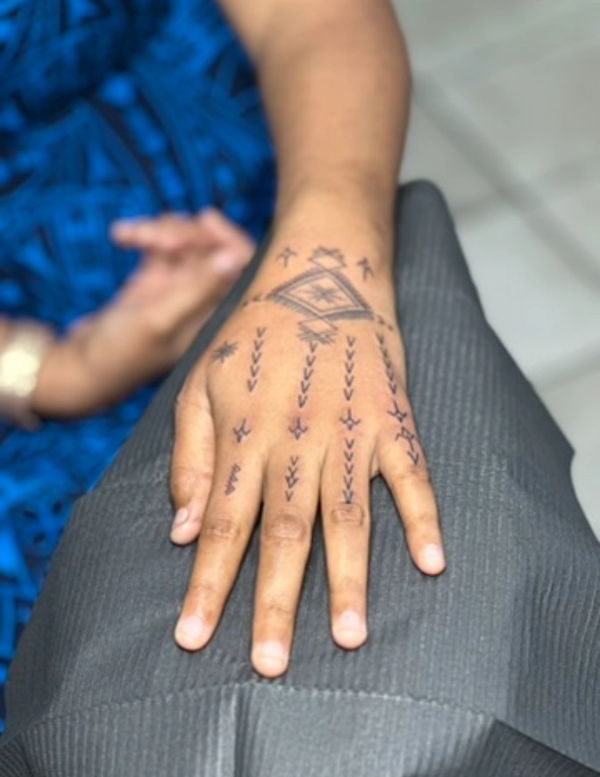 Blackwork geometric design on hand
