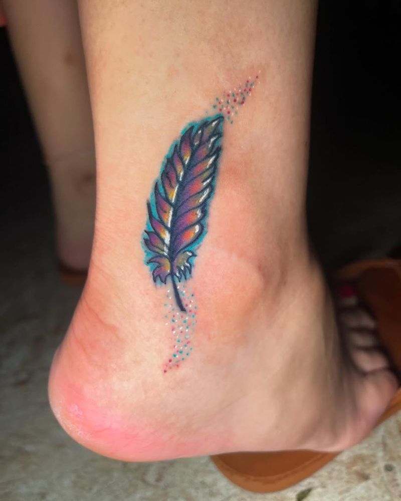 Small colorful feather tattoo on the foot
