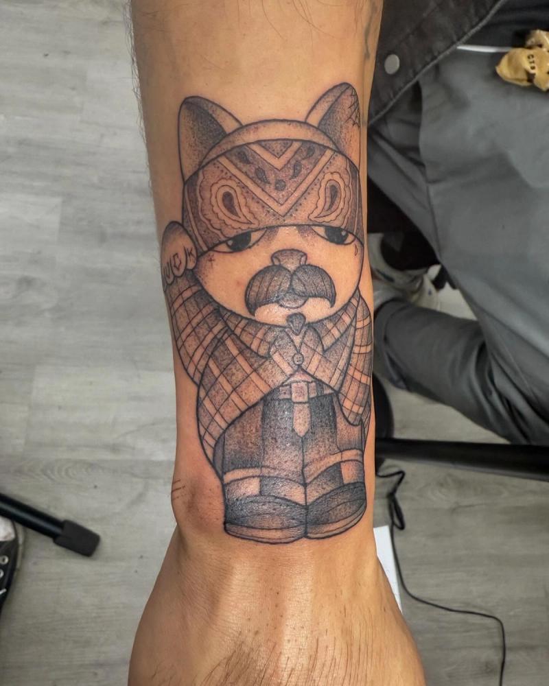 Blackwork illustrative bear character tattoo on forearm