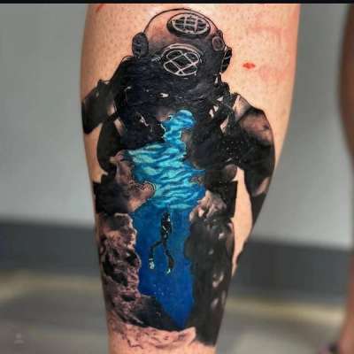 illustrative tattoo of a deep-sea diver on the calf