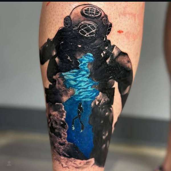 illustrative tattoo of a deep-sea diver on the calf
