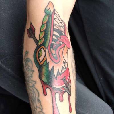 colorful wolf tattoo on forearm