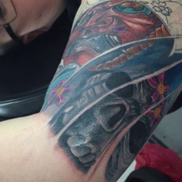 colorful japanese oni tattoo on upper arm