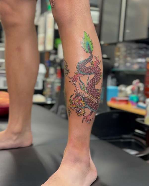 Colorful Japanese dragon tattoo on calf