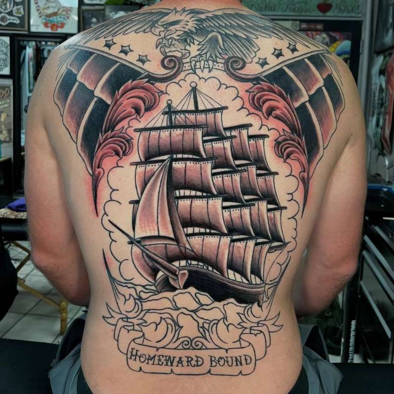 Colorful traditional ship and eagle tattoo covering full back