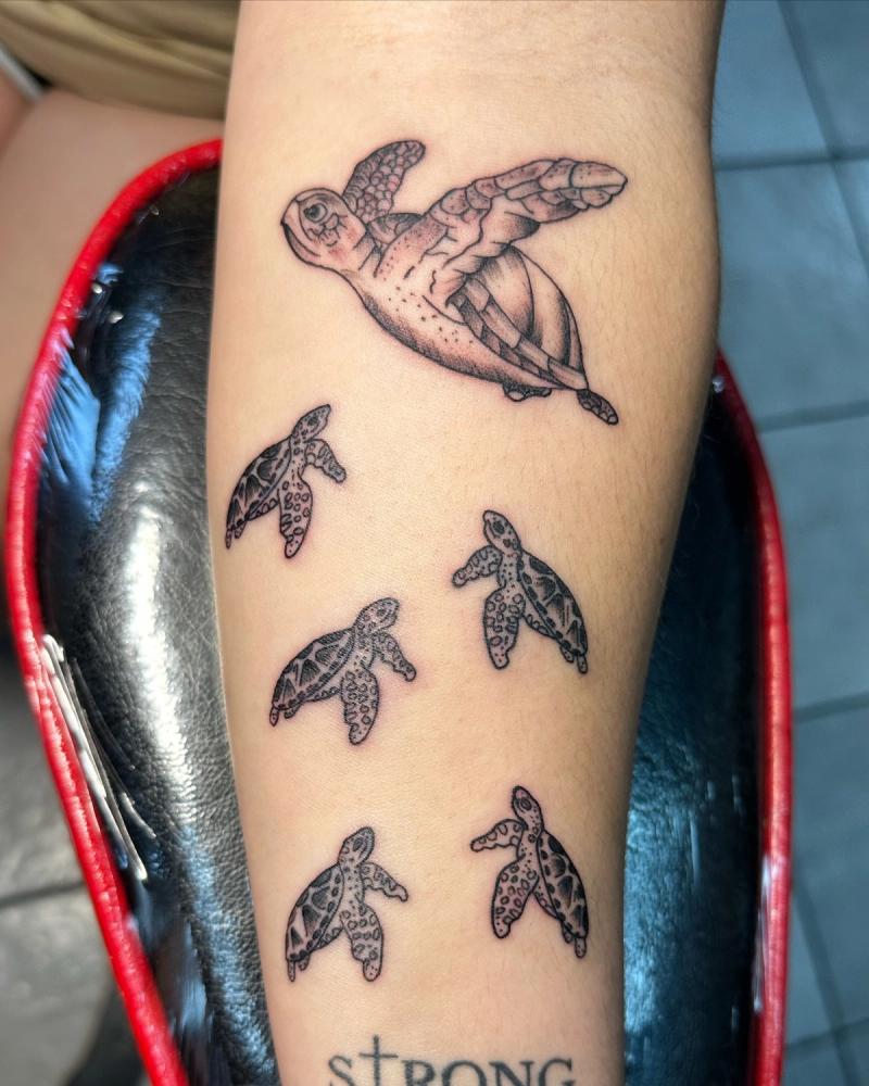 illustrative turtle tattoo on forearm