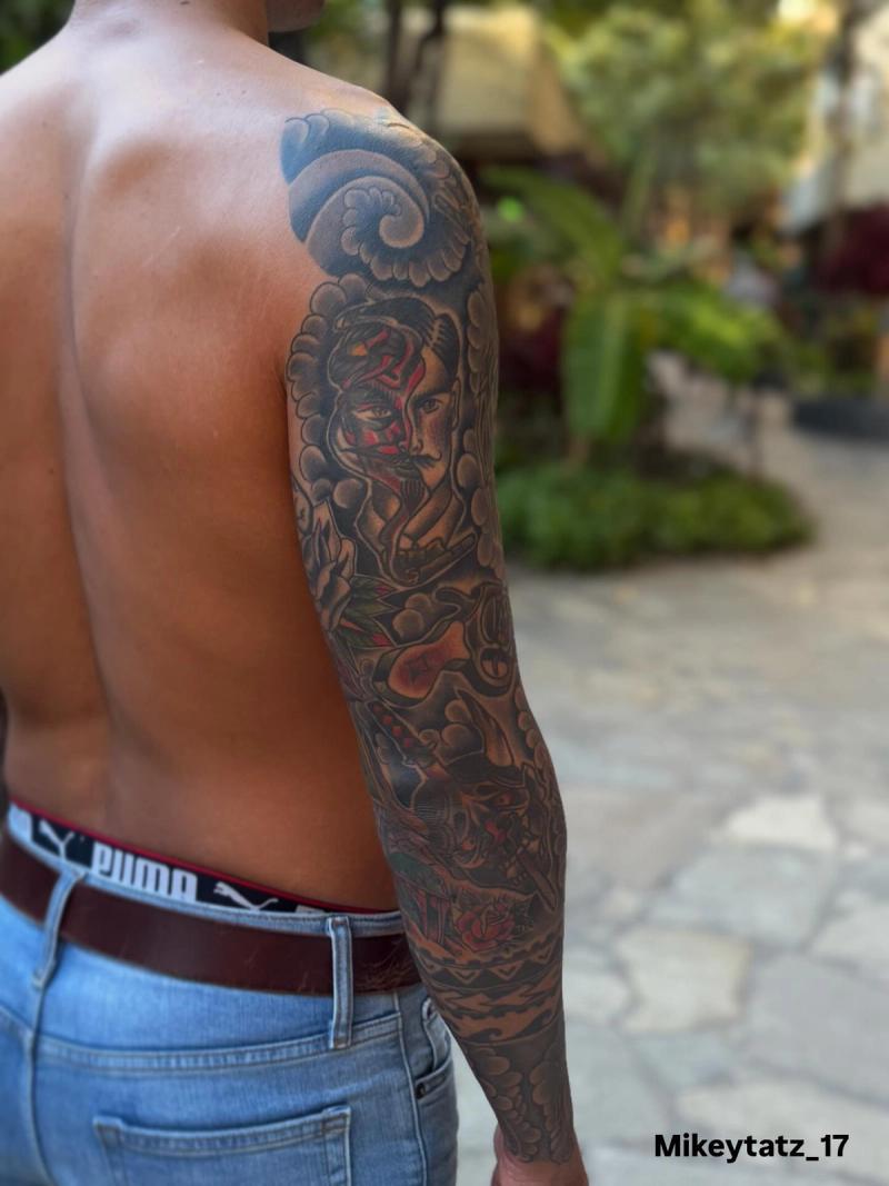 japanese traditional full sleeve tattoo with warrior figure and cloud patterns