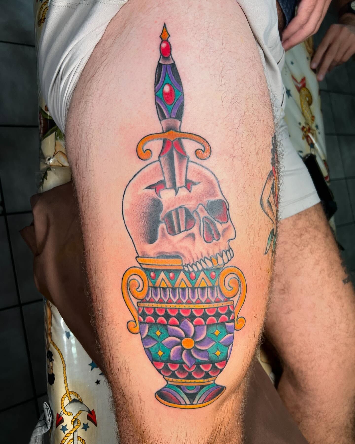 Colorful Neo Traditional skull with ornate vase on thigh