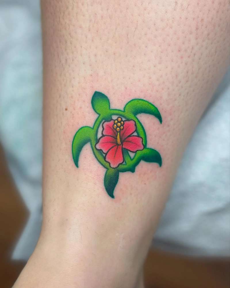 turtle and hibiscus tattoo on calf