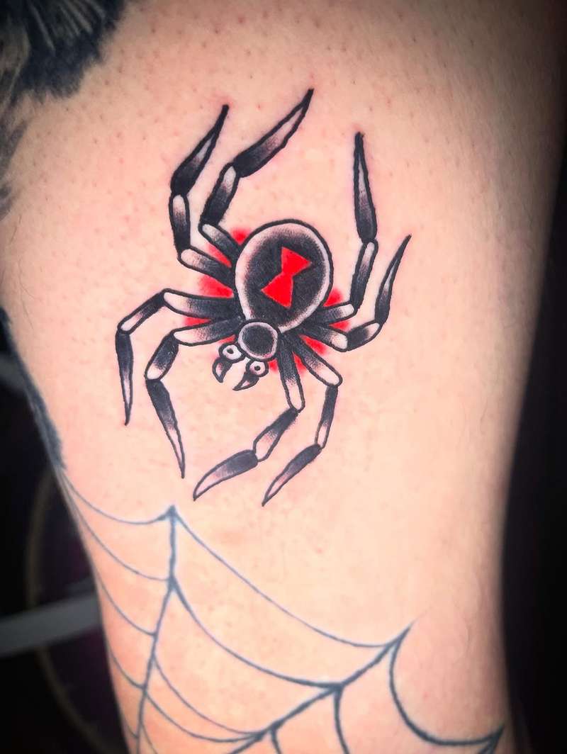 Color illustrative black widow spider tattoo on thigh