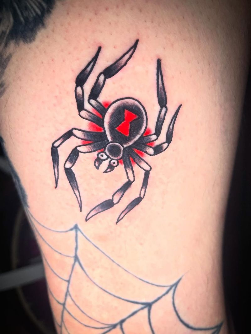 Color illustrative black widow spider tattoo on thigh
