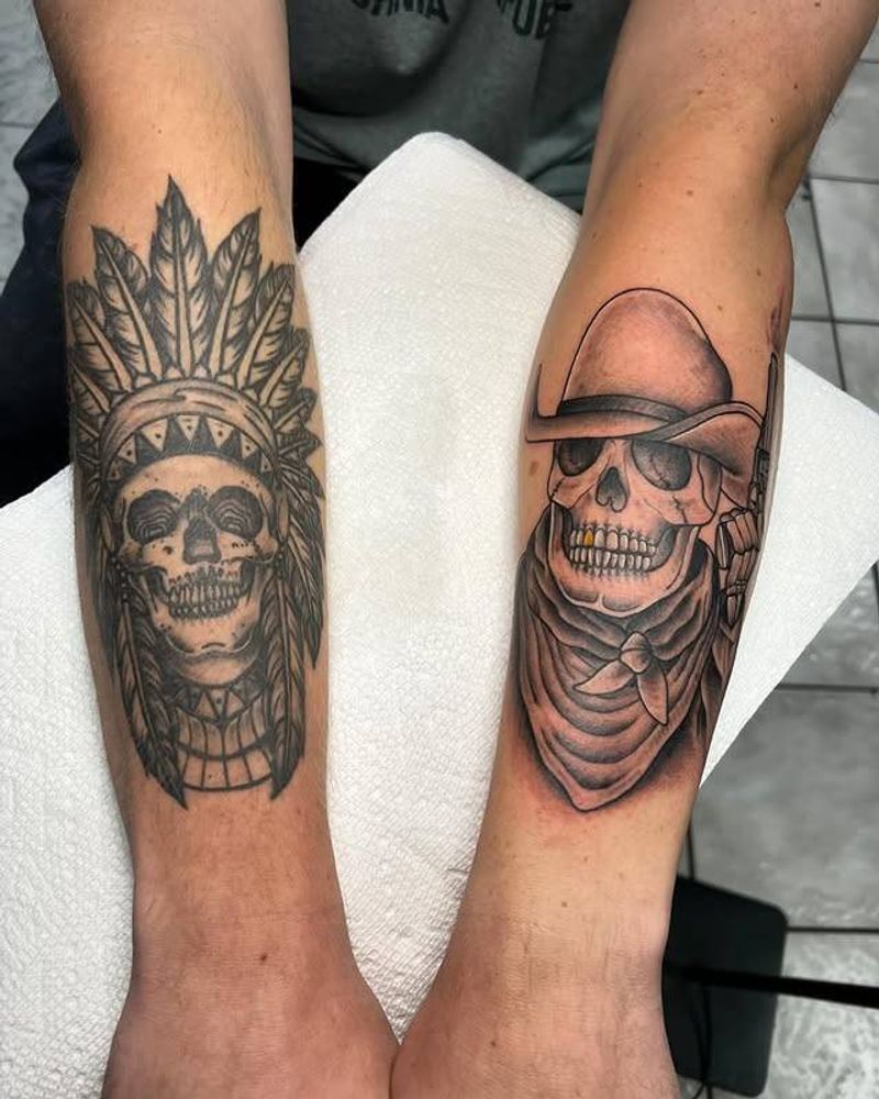 Black and grey Native American and colored cowboy skull tattoos on forearms