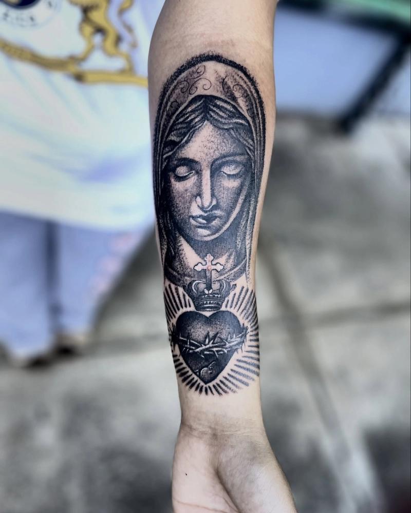 virgin mary sacred heart forearm tattoo