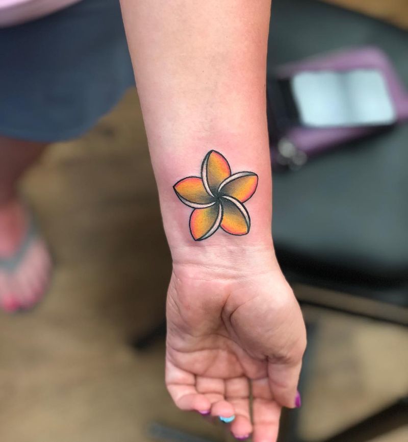 plumeria flower tattoo on forearm