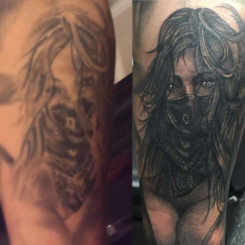 Black and grey realistic female portrait tattoo on upper arm